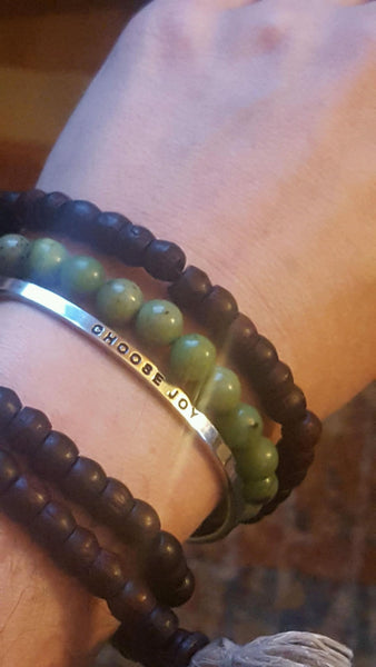 customer wrist with Jade Bracelet and other bracelets