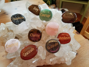 words stones on quartz cluster